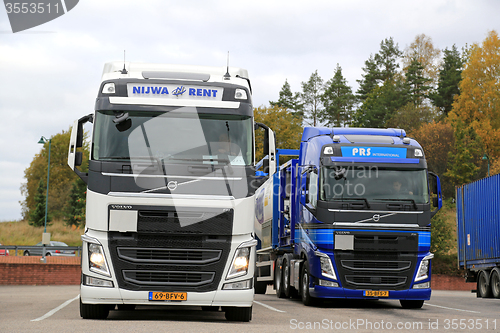 Image of Two Volvo FH Tank Trucks Leaving Truck Stop