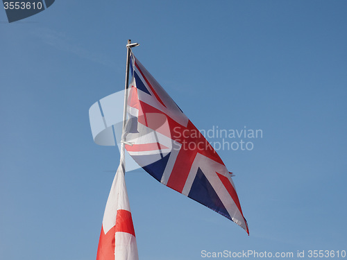 Image of Flag of UK over blue sky