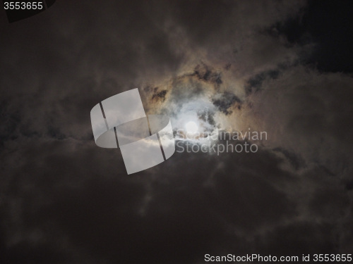 Image of Moon in dark cloudy night sky