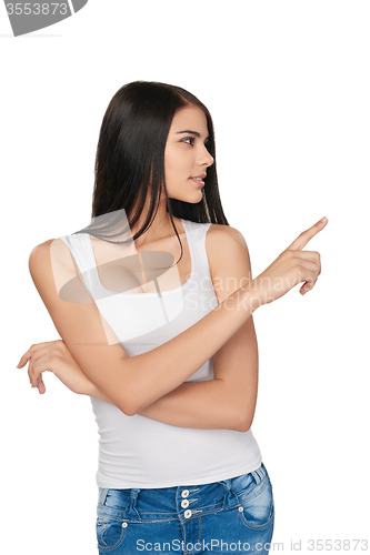 Image of Casual woman pointing at white background