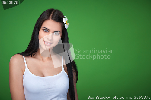 Image of Teen female with Plumeria Flower