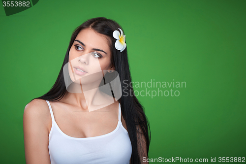 Image of Teen female with Plumeria Flower