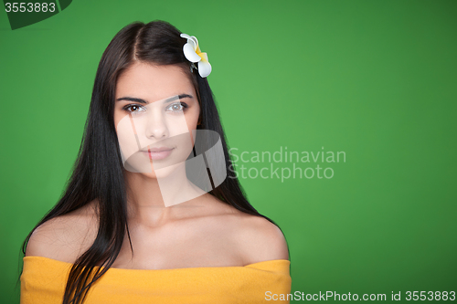 Image of Teen female with Plumeria Flower