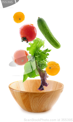 Image of Fresh vegetables falling