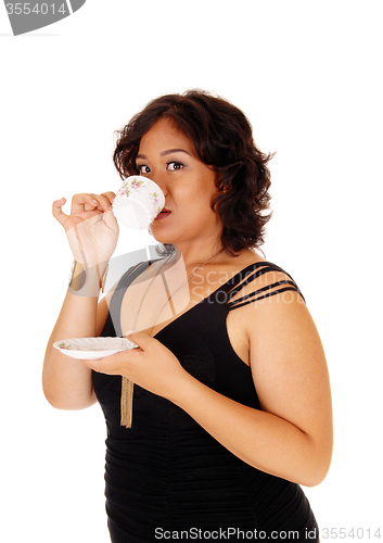 Image of Woman drinking cup of coffee.