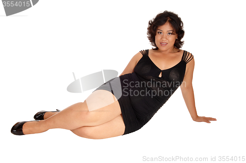 Image of Pretty lady sitting on floor.