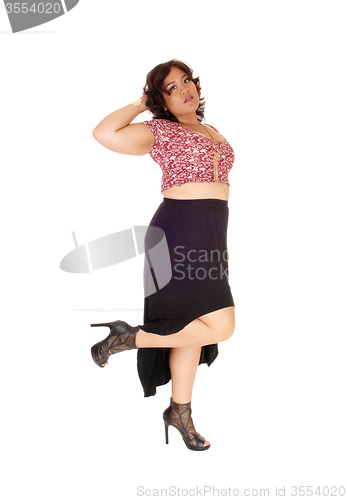 Image of Young plus size woman standing.