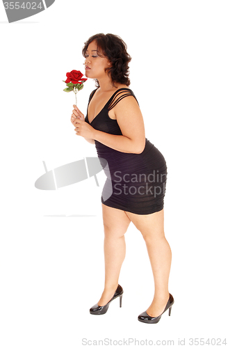 Image of Lovely woman with red rose.