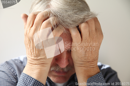 Image of older man depressed