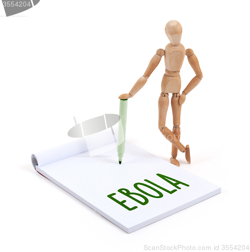 Image of Wooden mannequin writing - Ebola