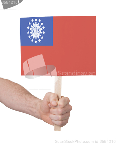 Image of Hand holding small card - Flag of Myanmar