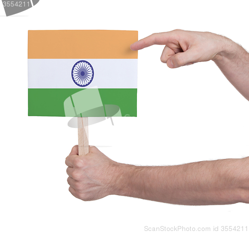 Image of Hand holding small card - Flag of India