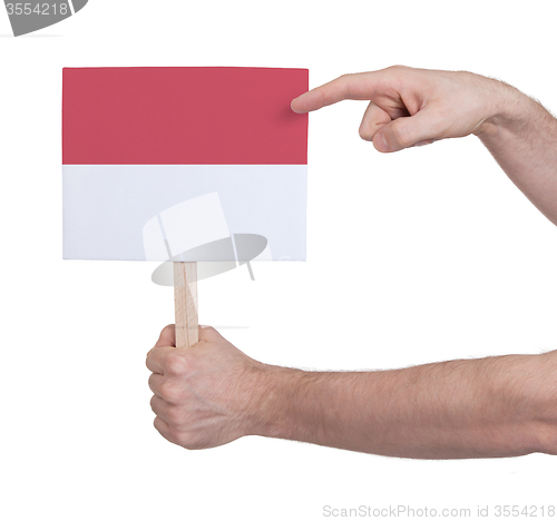 Image of Hand holding small card - Flag of Indonesia