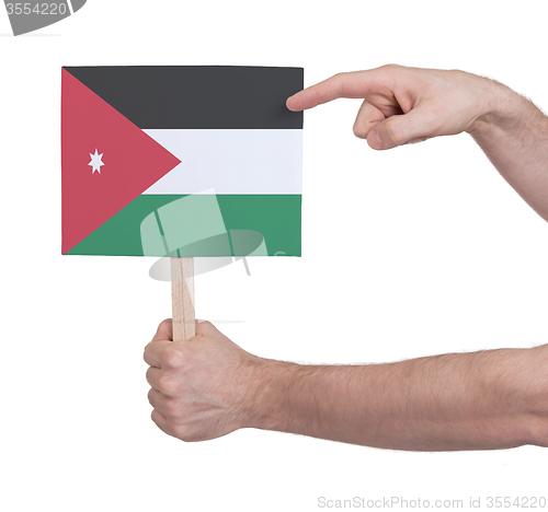 Image of Hand holding small card - Flag of Jordan