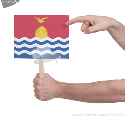 Image of Hand holding small card - Flag of Kiribati