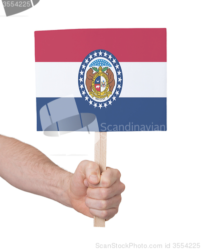 Image of Hand holding small card - Flag of Missouri