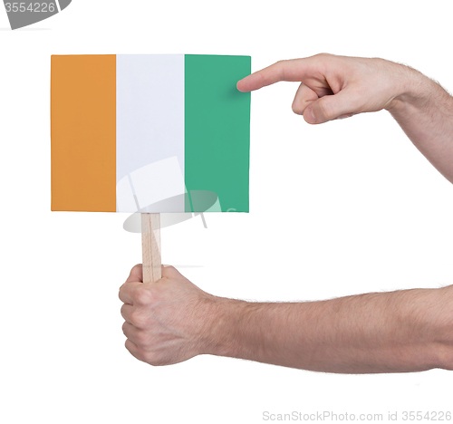 Image of Hand holding small card - Flag of Ivory Coast