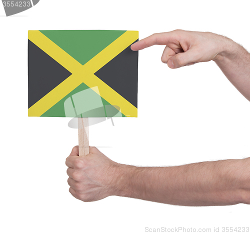 Image of Hand holding small card - Flag of Jamaica