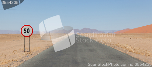 Image of Speed limit sign at a desert road in Namibia