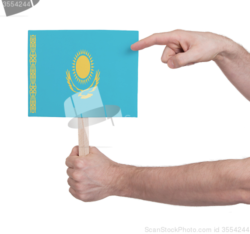 Image of Hand holding small card - Flag of Kazakhstan