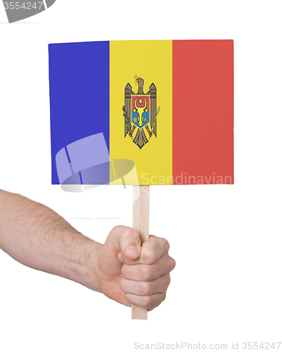 Image of Hand holding small card - Flag of Moldova