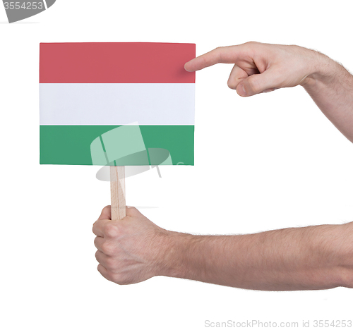 Image of Hand holding small card - Flag of Hungary