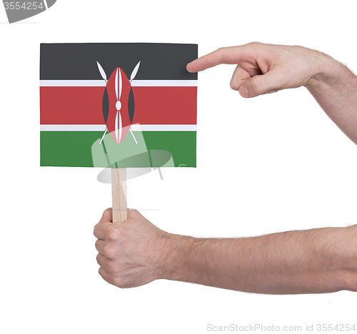 Image of Hand holding small card - Flag of Kenya