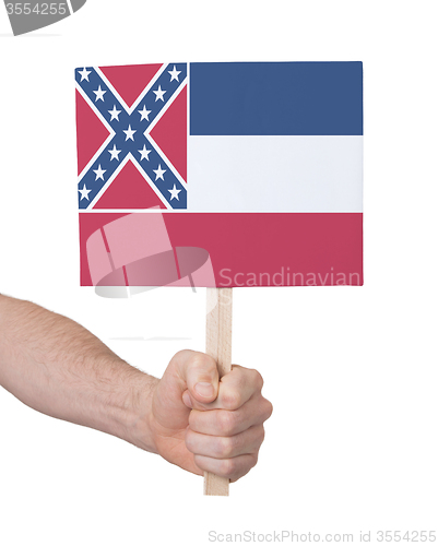 Image of Hand holding small card - Flag of Mississippi