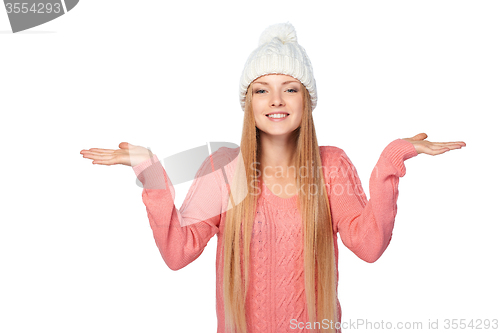 Image of Winter girl holding copy space on her palms