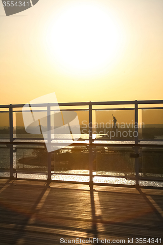 Image of View of Liberty Statue through ship fence