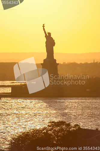 Image of Statue of Liberty in United States at sunset
