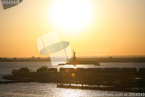 Image of Liberty Statue silhouette at sunset