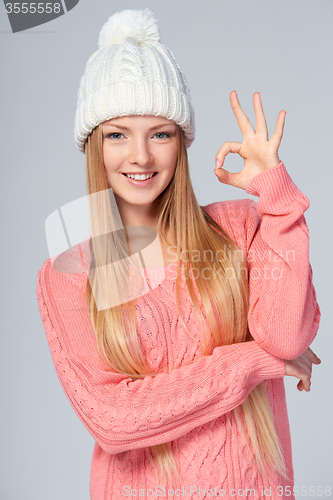Image of Christmas girl gesturing OK sign