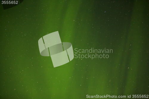 Image of Northern lights with bright stars in Iceland