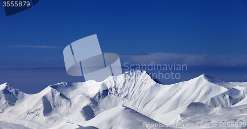 Image of Panoramic view on off-piste snowy slope at nice sunny day