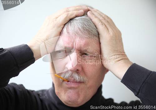 Image of senior man with flu symptoms