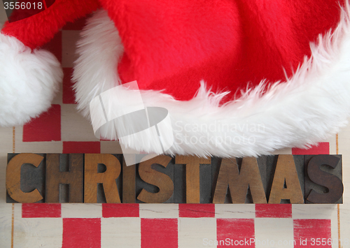 Image of Christmas word with Santa Claus hat	