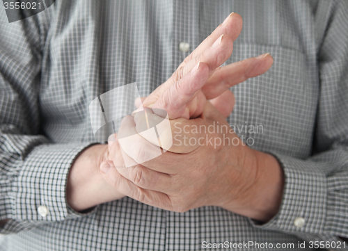 Image of man with numbness in hand