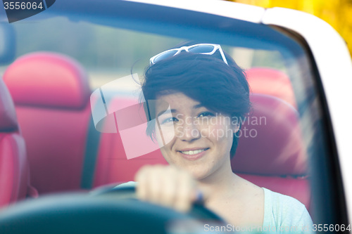 Image of Woman Driving a Convertible