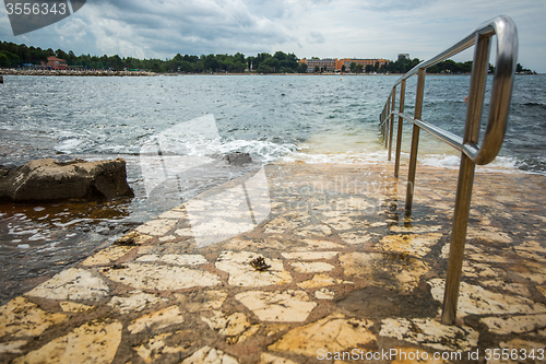 Image of metal rail for descent to water