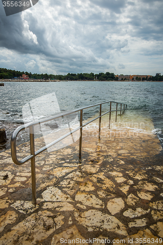 Image of metal rail for descent to water