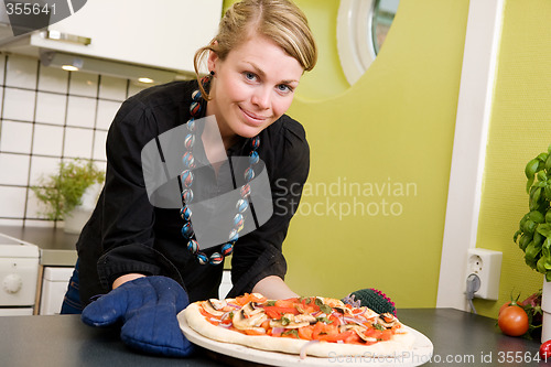 Image of Woman with Fresh Pizza