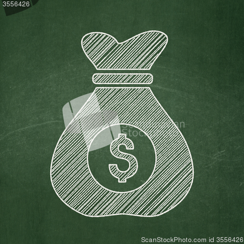 Image of Finance concept: Money Bag on chalkboard background