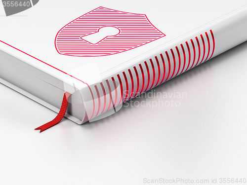 Image of Safety concept: closed book, Shield With Keyhole on white background