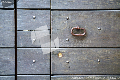 Image of abstract   rusty  in   door curch  closed wood lombardy italy  v