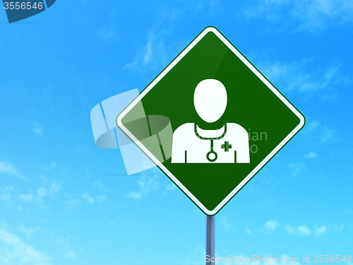 Image of Healthcare concept: Doctor on road sign background