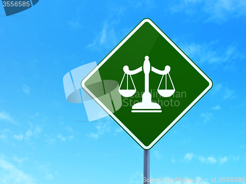 Image of Law concept: Scales on road sign background