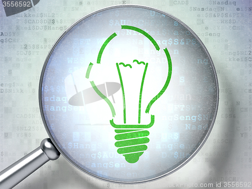 Image of Finance concept: Light Bulb with optical glass on digital background