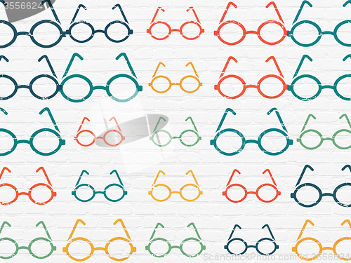 Image of Education concept: Glasses icons on wall background