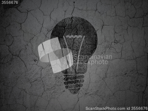 Image of Finance concept: Light Bulb on grunge wall background